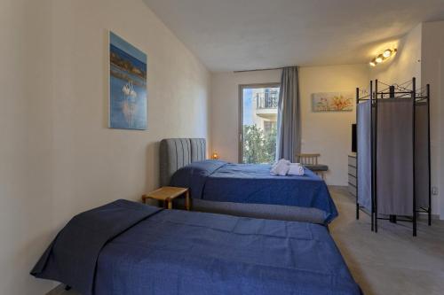 a hotel room with two beds and a window at Gl holiday home in Marsala