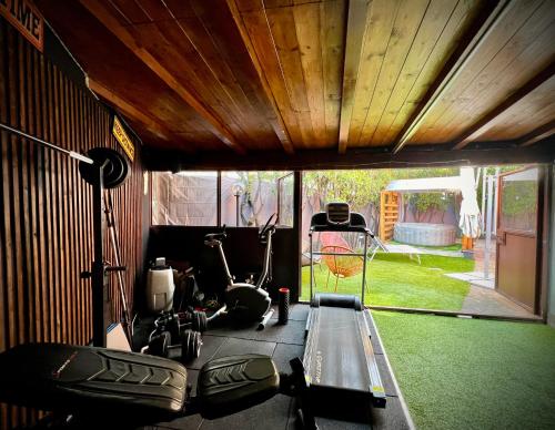 a gym with a treadmill and an exercise bike at La Perla in Monza