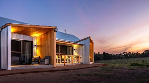 a house with a view of the sunset at Benbullen Retreat in Angaston