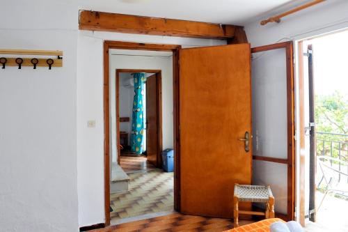 an open door in a room with a hallway at PensionMargaritaKotroniSkiathos in Skiathos Town