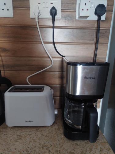 a coffee maker and a blender on a counter at The Light Villa Flic en Flac LICENSED BY TOURISM AUTHORITY 16609 in Palmyre