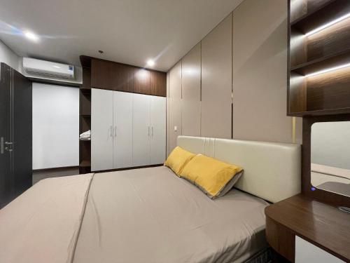 Cama o camas de una habitación en Homestay Honey Appartment Hải Phòng - Hoàng Huy Grand Tower