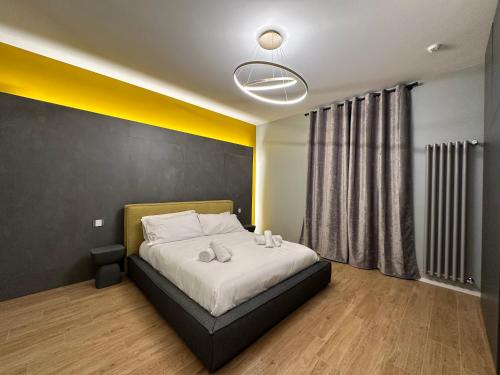 a bedroom with a bed with two towels on it at Dimora Del Ragno in Tivoli