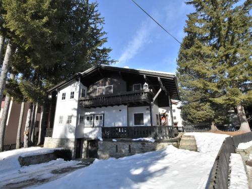 a house in the snow with a fence at Chalet Chalet Franca by Interhome in Madesimo
