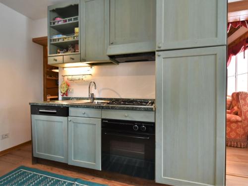 a kitchen with a sink and a stove top oven at Chalet Chalet Franca by Interhome in Madesimo