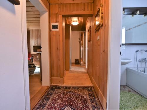 a hallway leading to a bathroom with a tub at Chalet Chalet Franca by Interhome in Madesimo