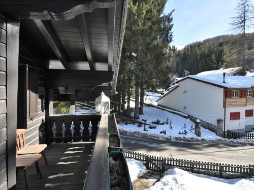 a porch of a house with snow on the ground at Chalet Chalet Franca by Interhome in Madesimo