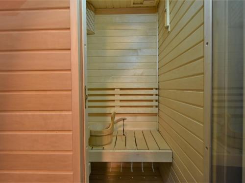 a sauna with a bucket in the middle at Chalet Chalet Franca by Interhome in Madesimo