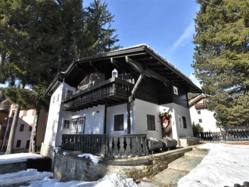 a house with a balcony in the snow at Chalet Chalet Franca by Interhome in Madesimo
