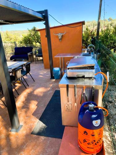 a grill sitting on top of a patio with a table at Relais Pollo Loco in Valencia