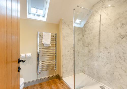 a bathroom with a shower and a toilet and a sink at The Pear Tree - Pershore in Pershore