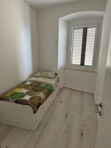Postel nebo postele na pokoji v ubytování Apartman Mia