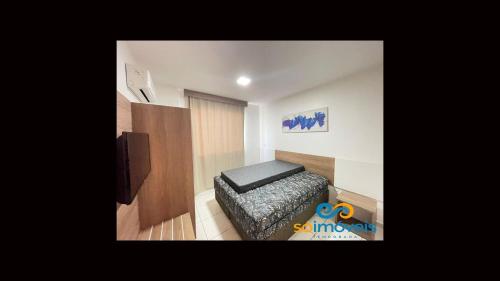 卡达斯诺瓦斯Riviera 1 Quarto的一间带床的小房间