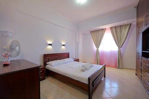 Ένα ή περισσότερα κρεβάτια σε δωμάτιο στο Valentina Apartment 2