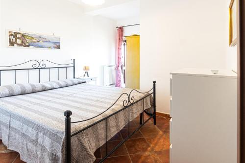 a bedroom with a bed in a room at Bellezza In Cilento Panoramic Apts in Castellabate