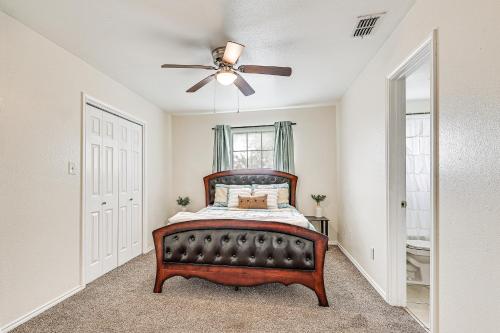 a bedroom with a bed and a ceiling fan at Pet-Friendly Edinburg Townhome - Near Stadiums! in Edinburg