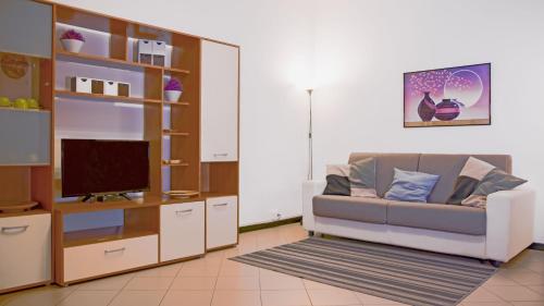 A television and/or entertainment centre at The History Apartment - Le Cà De Boron