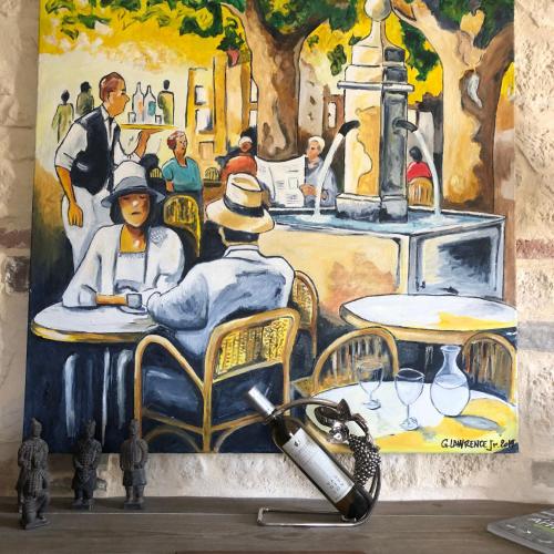 un dipinto di due persone sedute a un tavolo di la maison des ateliers a Solférino