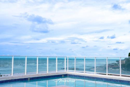 a view of the ocean from the pool at Blue Sunset in Penha