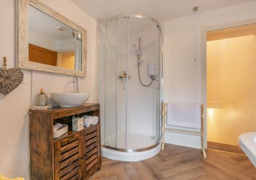 a bathroom with a shower and a sink at Viaduct View in Ingleton