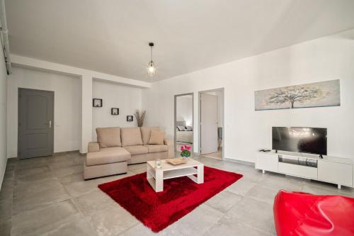 a living room with a couch and a red rug at BmyGuest - Sesimbra Country View Villa in Sesimbra