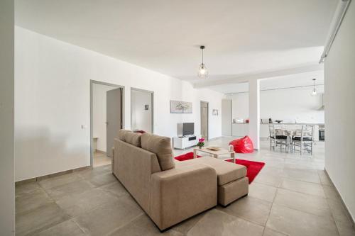 a living room with a couch and a table at BmyGuest - Sesimbra Country View Villa in Sesimbra