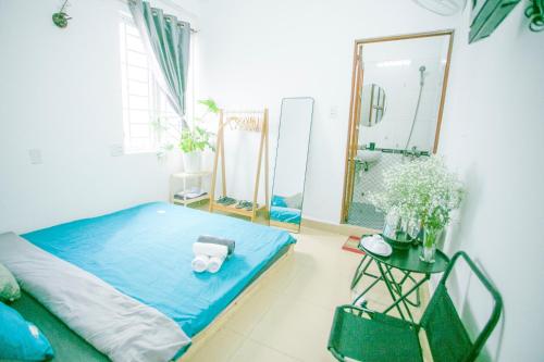 Postel nebo postele na pokoji v ubytování Pearl Wealth Dalat Hotel