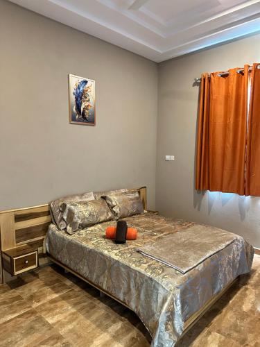 a bedroom with a large bed in a room at Nanani Villa - Harmonious Paradise in Kumasi