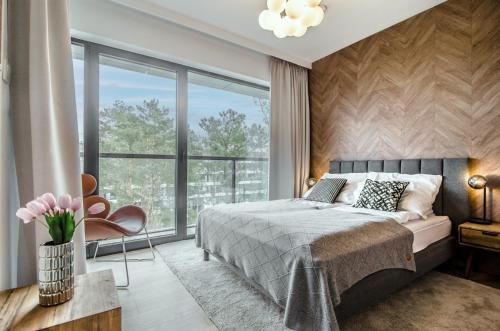 Ліжко або ліжка в номері Apartamenty Prezydenckie - Morski Szum - Alldayholiday