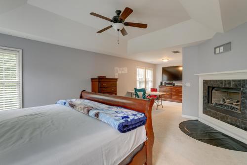 a bedroom with a bed and a fireplace at Spacious Home about 7 Mi to Stone Mountain Park! in Stone Mountain