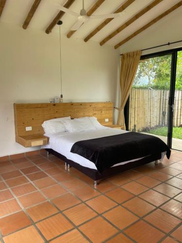 Un pat sau paturi într-o cameră la Ecohotel Alma
