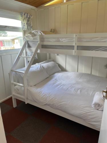 a couple of bunk beds in a room at Chalet 31 in Seaton