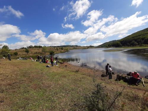 a group of people standing next to a lake at BB Cesarò Mariolo house in Cesarò