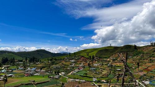 a view of a village on a hill at Viewscape in Nuwara Eliya