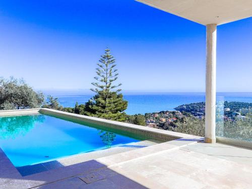 a swimming pool with a view of the ocean at Villa La Concorde by Interhome in Roquebrune-Cap-Martin
