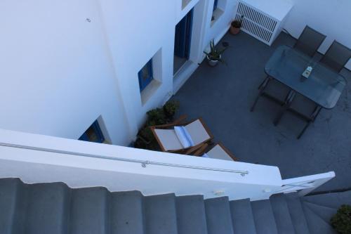 an overhead view of a balcony with a chair and a table at Mary Castelia Villa 2 with Jacuzzi in Akrotiri