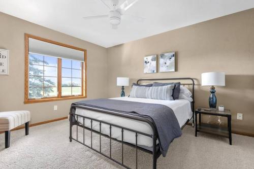 a bedroom with a large bed and a window at Kalbus House- Lake Winnebago access across the street in Oshkosh