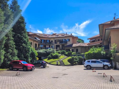 a group of cars parked in a parking lot at Apartment Haridian by Interhome in Porto Valtravaglia