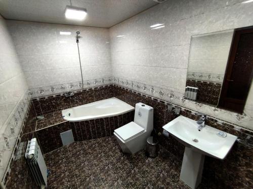 Koupelna v ubytování Шербудин