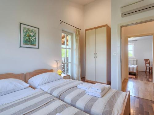 Katil atau katil-katil dalam bilik di Villa Azura by Interhome