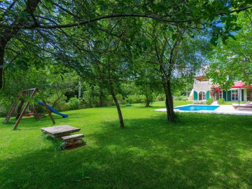 a yard with a playground and a swing at Villa Bella by Interhome in Marčana