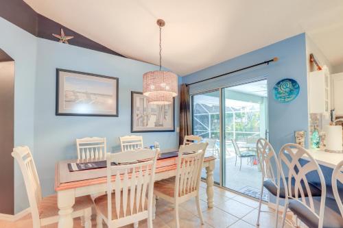 a dining room with a table and chairs at Jensen Beach Home with Heated Pool! in Jensen Beach