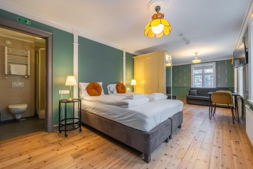 a bedroom with a large bed and a couch at Day Dream Historical Grjótagata 4 in Reykjavík