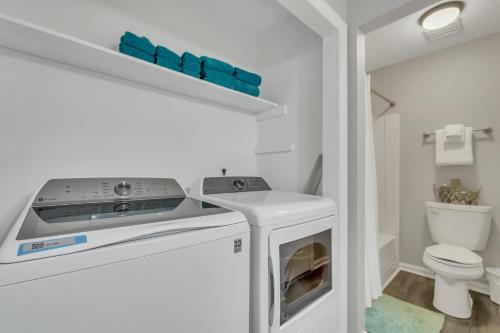 a white laundry room with a washer and dryer at Sagebrush Suite - Close to Paulson Stadium GSU in Statesboro