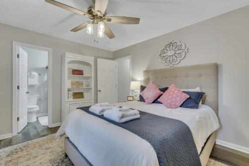 a bedroom with a bed and a ceiling fan at Sagebrush Suite - Close to Paulson Stadium GSU in Statesboro