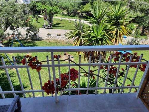 a balcony with a view of a park at Two Brothers Studios Tsilivi Zakynthos in Tsilivi