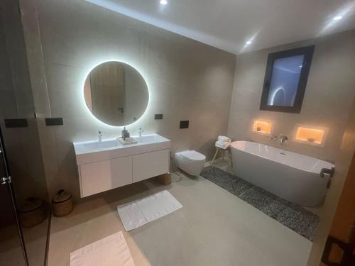 a bathroom with a sink toilet and a mirror at villa in Marrakesh