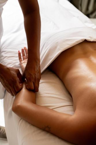 a woman laying on a bed with her legs at Bufo Alvarius in Tulum