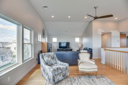 a living room with a couch and two chairs at Narragansett Home with Scenic Views Walk to Beach! in Narragansett