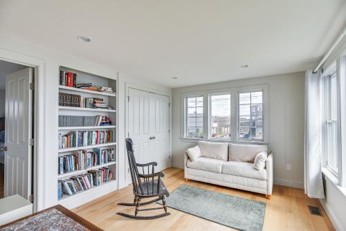 a living room with a chair and a couch at Narragansett Home with Scenic Views Walk to Beach! in Narragansett